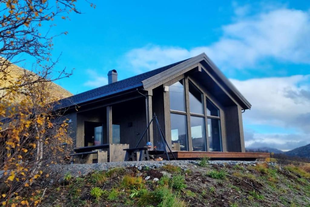 a house on top of a hill at Fjellhytte på hardangervidden med uforglemmelig utsikt! in Garden