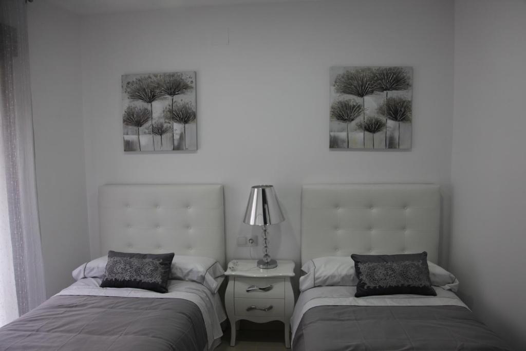 Postel nebo postele na pokoji v ubytování Apartamentos Alogia, Pastora, Yerbater