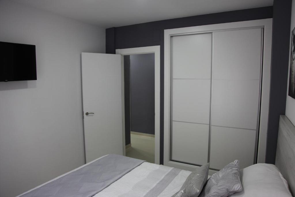 Postel nebo postele na pokoji v ubytování Apartamentos Alogia, Pastora, Yerbater