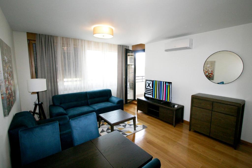 a living room with a couch and a table at Apartment Lara in Belgrade