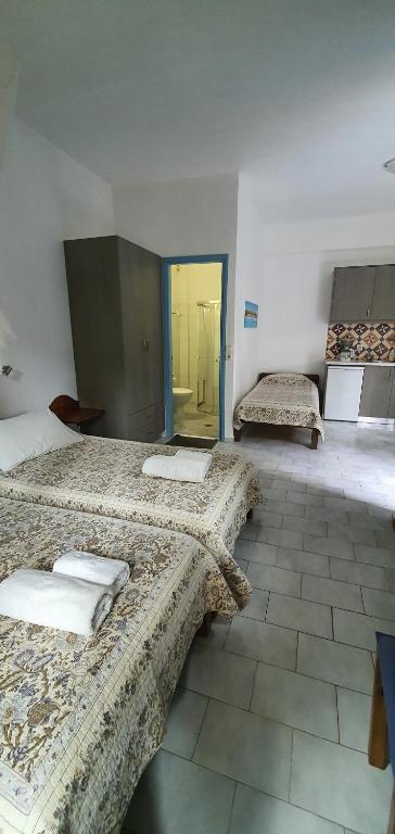 A bed or beds in a room at Irini Studios