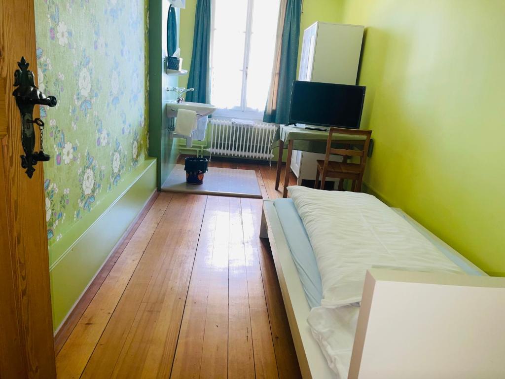 Ένα ή περισσότερα κρεβάτια σε δωμάτιο στο Hotel Sternen Worb