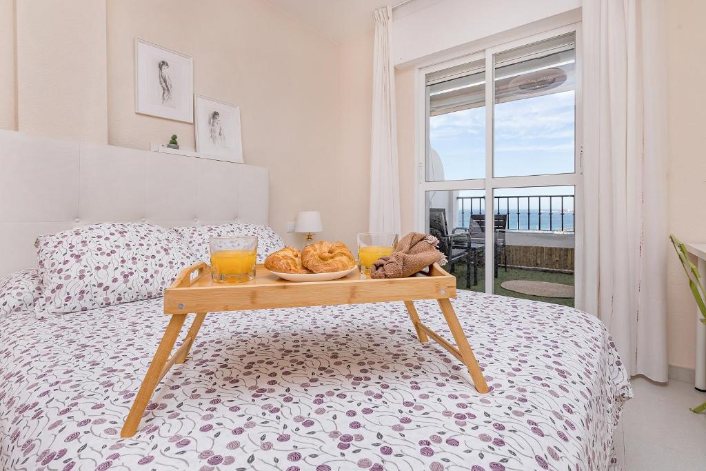 A bed or beds in a room at Sunshine Balcony- La Caleta
