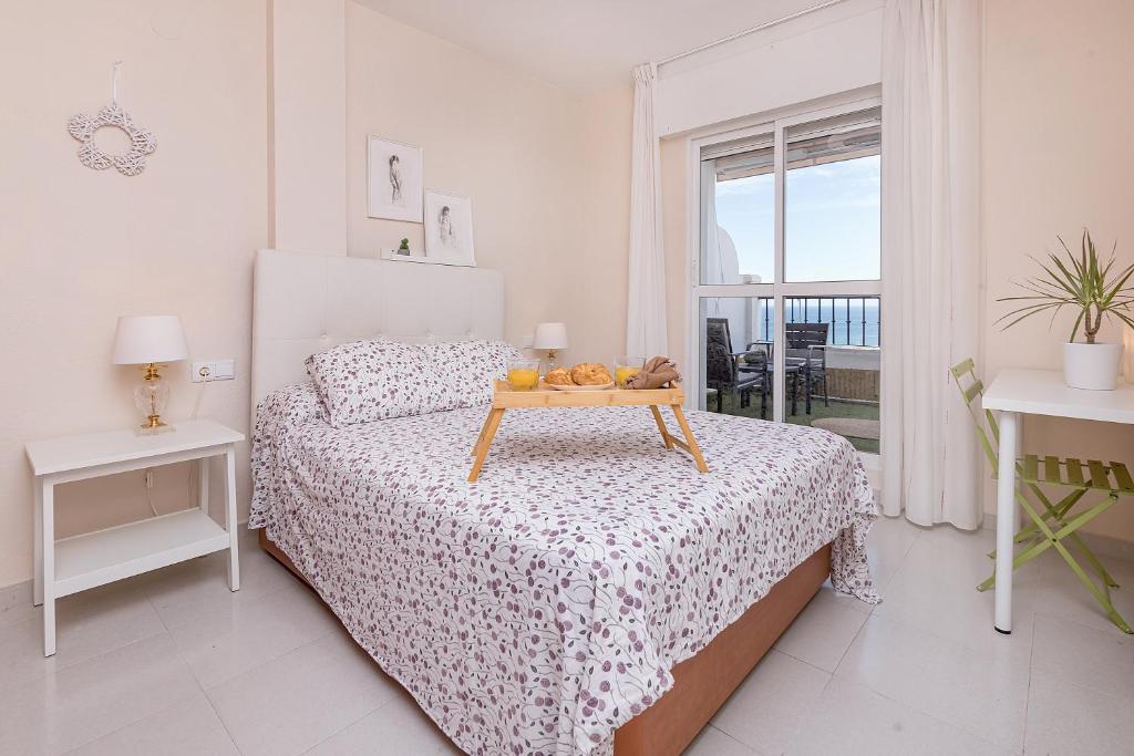 A bed or beds in a room at Sunshine Balcony- La Caleta