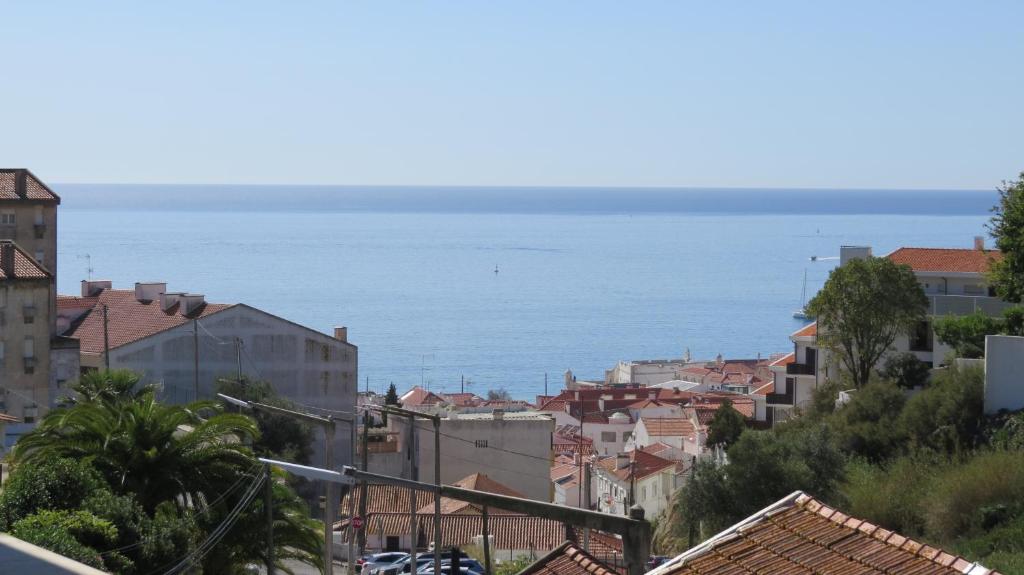 a view of the ocean from a city at Ocean View Dive House in Sesimbra
