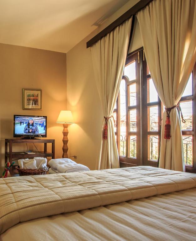 Postel nebo postele na pokoji v ubytování Hotel Plaza Yat Balam Anexo