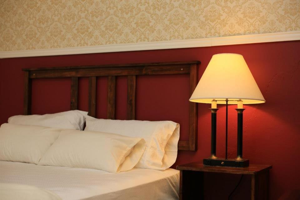 Postel nebo postele na pokoji v ubytování Hotel Plaza Yat Balam Anexo