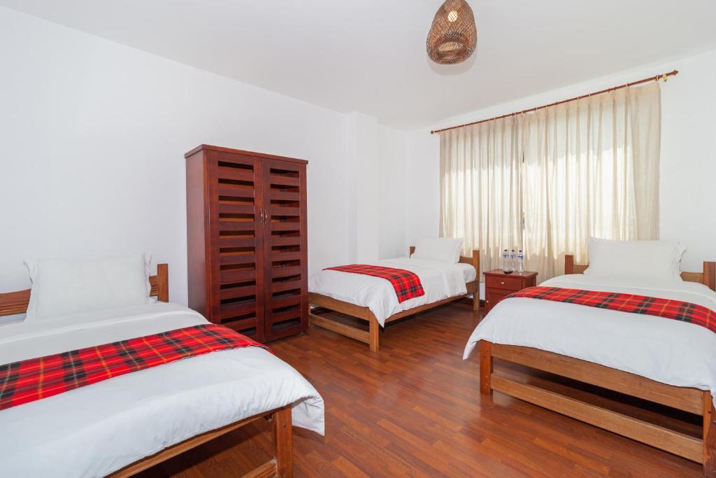 Postel nebo postele na pokoji v ubytování Napolitano Apart Hotel