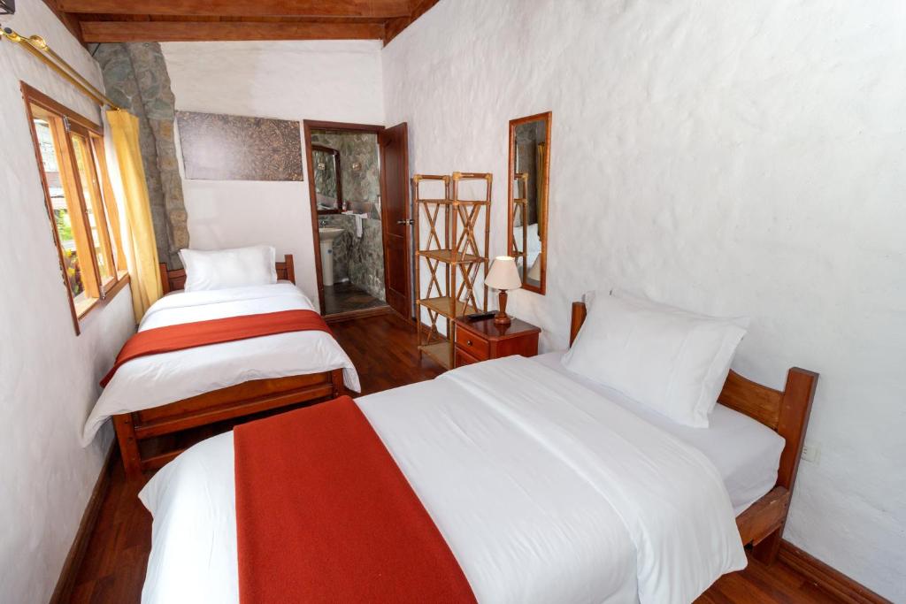 Postel nebo postele na pokoji v ubytování Napolitano Apart Hotel
