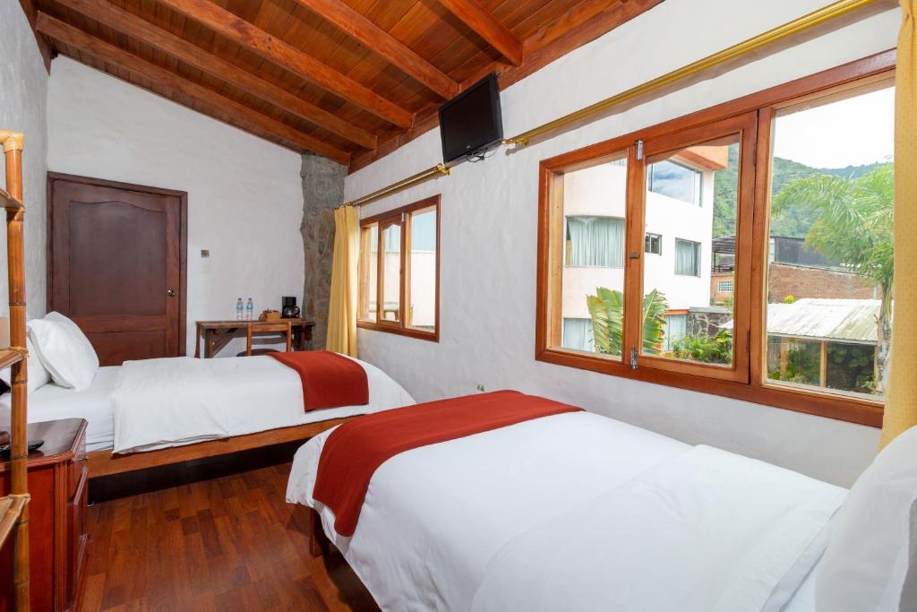 Postel nebo postele na pokoji v ubytování Napolitano Apart Hotel