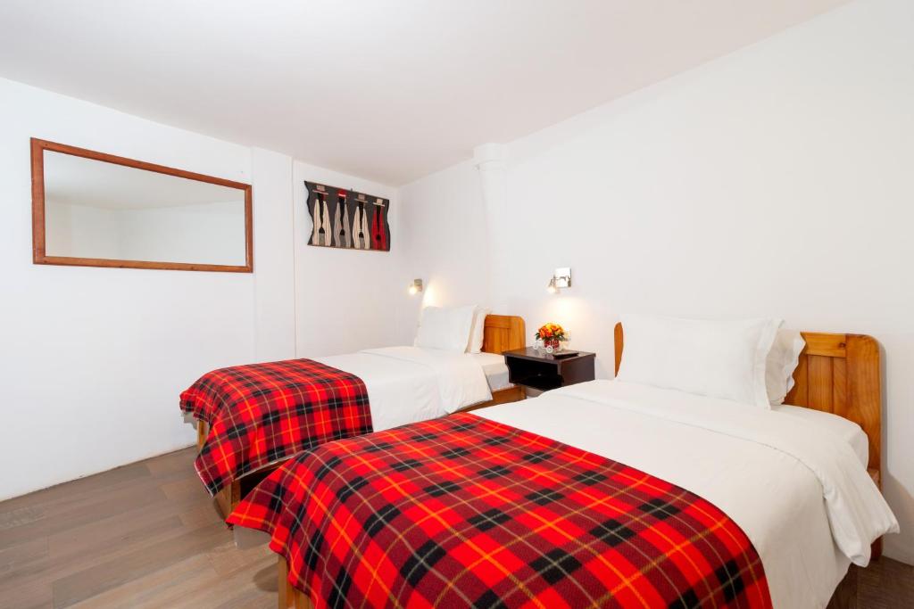 Postel nebo postele na pokoji v ubytování Napolitano Apart Hotel