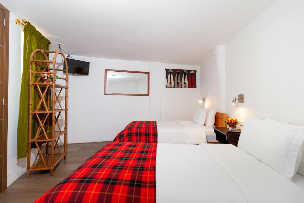 Postel nebo postele na pokoji v ubytování Napolitano Apart Hotel