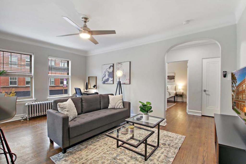 a living room with a couch and a ceiling fan at Adorable 1BR Apt in Evanston with Onsite Laundry - Elmwood 105 in Evanston