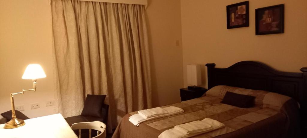 מיטה או מיטות בחדר ב-HOSPEDAJE DEL PASEO