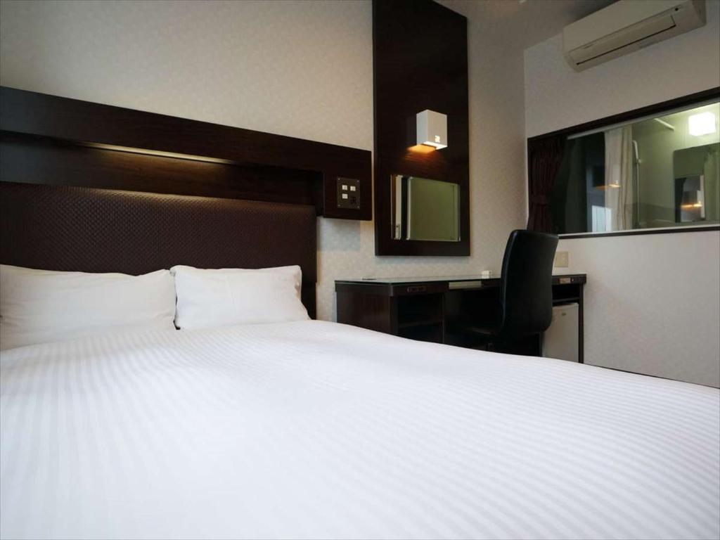Postel nebo postele na pokoji v ubytování Green Rich Hotel Osaka Airport