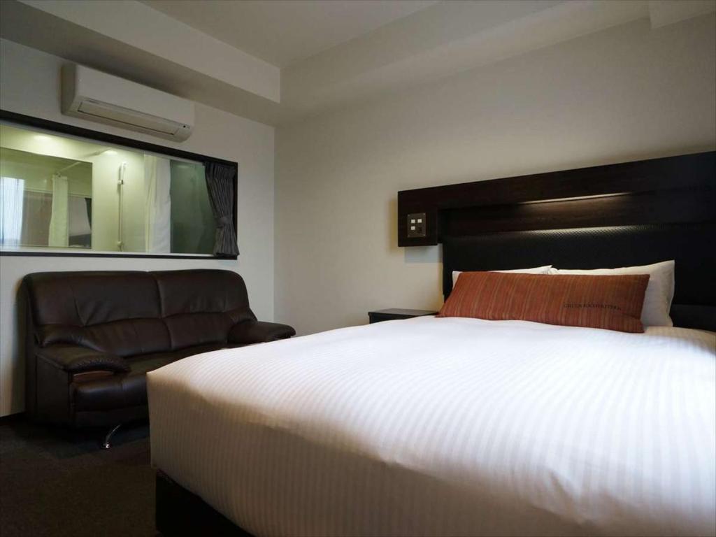 Postel nebo postele na pokoji v ubytování Green Rich Hotel Osaka Airport
