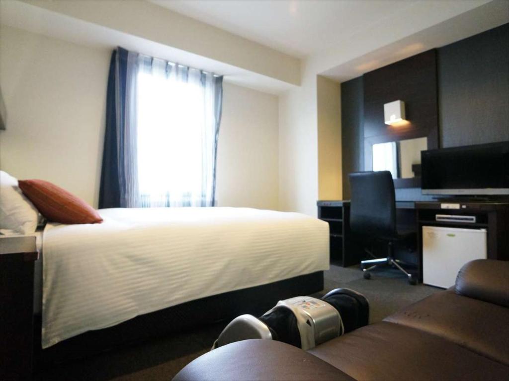 Postel nebo postele na pokoji v ubytování Green Rich Hotel Osaka Airport