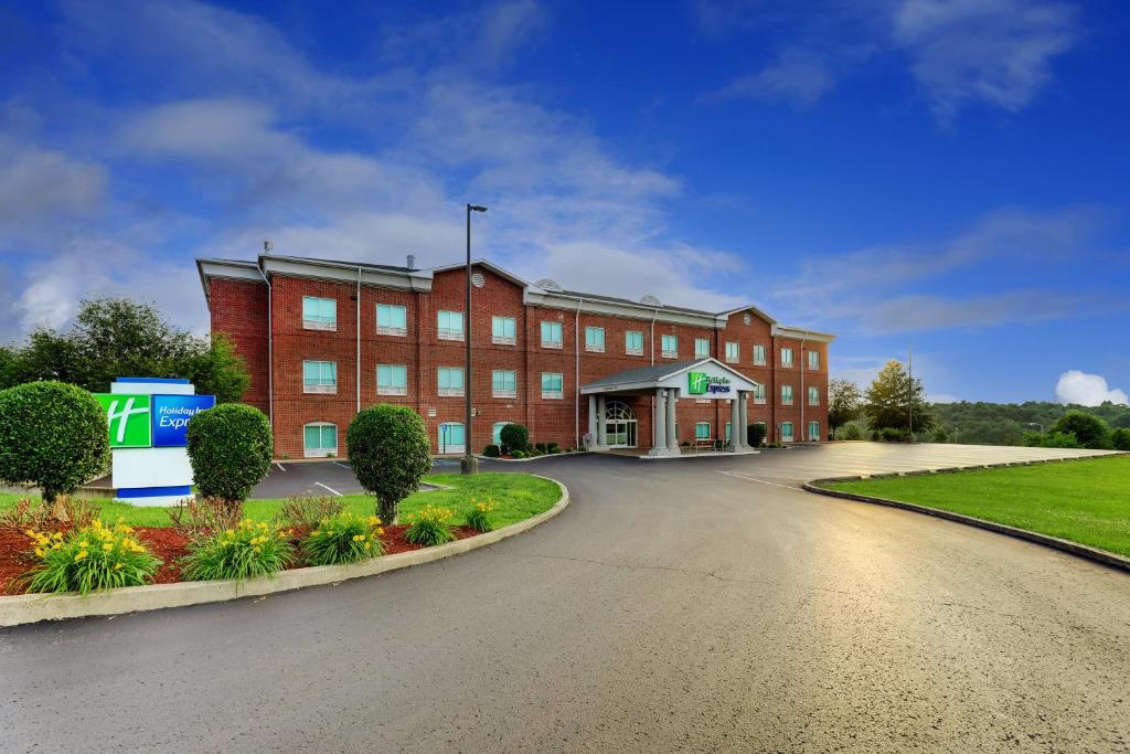 a large red brick building on a street at Holiday Inn Express Campbellsville, an IHG Hotel in Campbellsville
