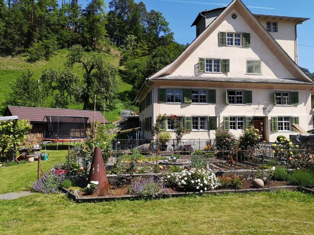 a house with a garden in front of it at Alte Mühle in Röthis