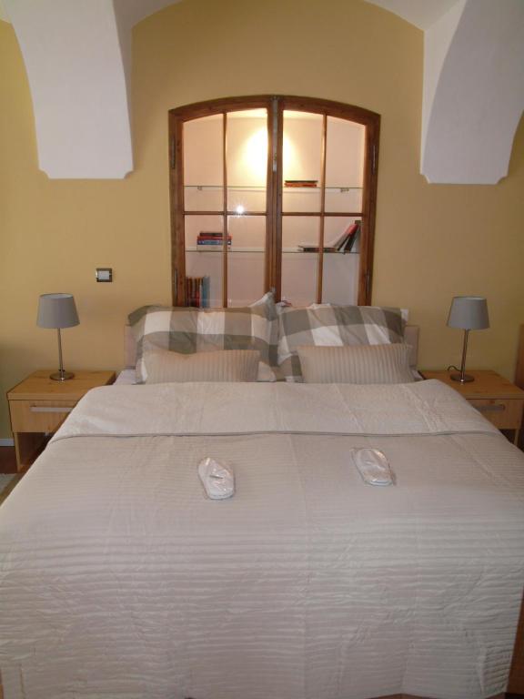 Posteľ alebo postele v izbe v ubytovaní Apartments and Suites Kremnica