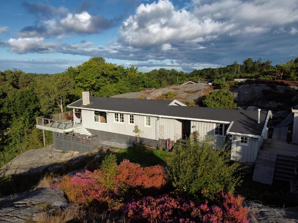 an aerial view of a house on a hill at Idyllic Cabin in Lillesand fantastic ocean view in Lillesand