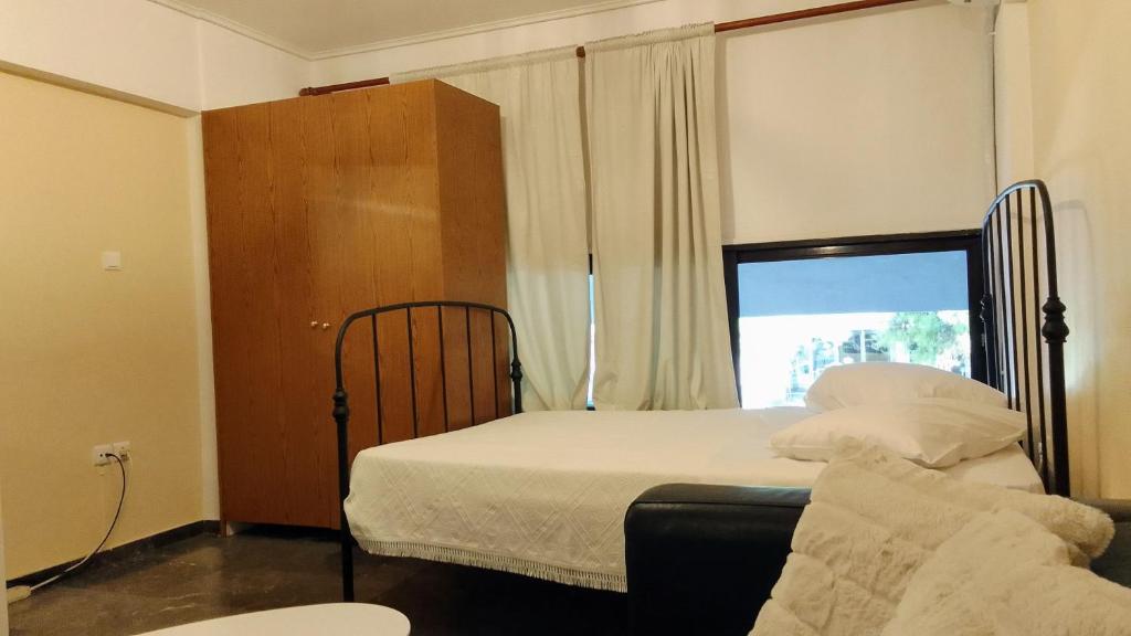 Postel nebo postele na pokoji v ubytování Central Athens Pad