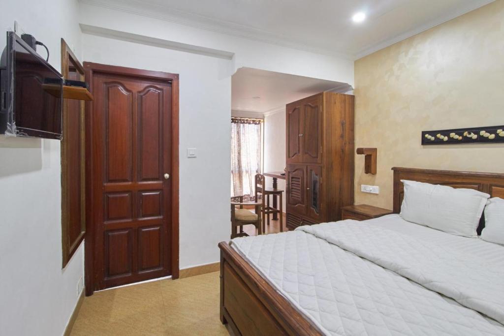 Postel nebo postele na pokoji v ubytování Hotel Mart View