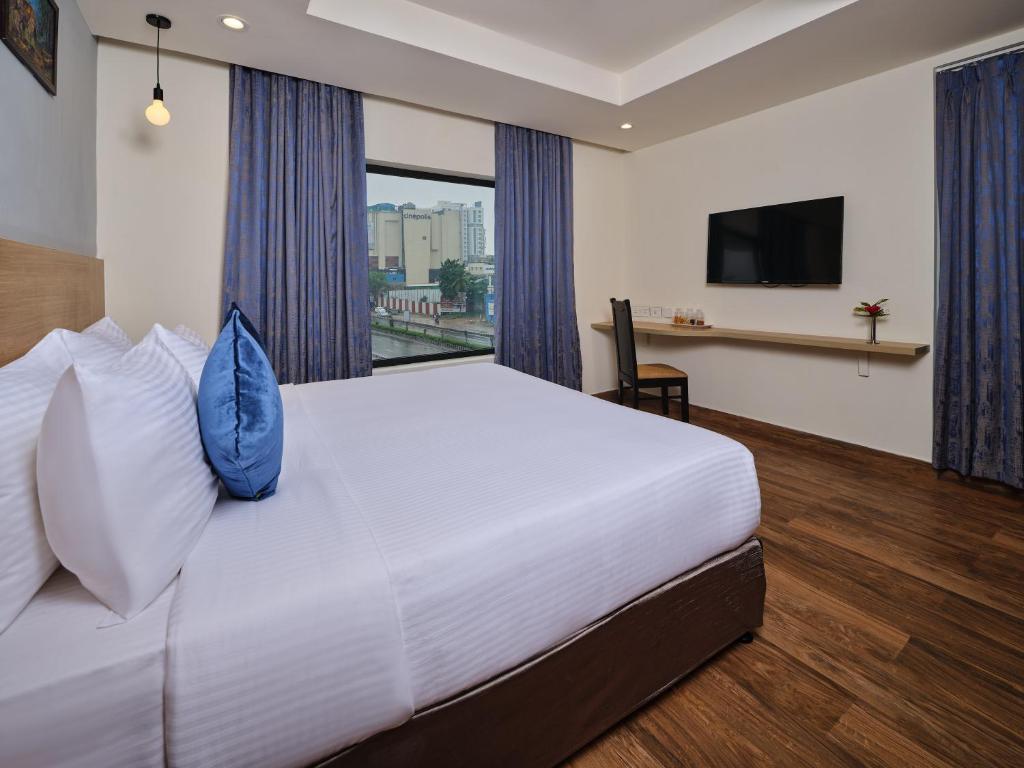Postel nebo postele na pokoji v ubytování Essentia Premier Hotel Chennai OMR