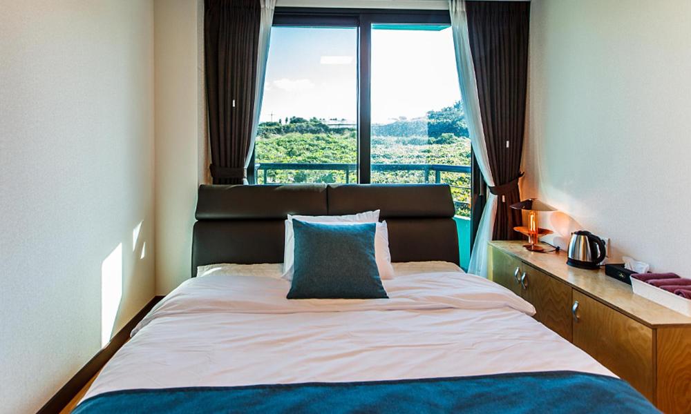 Postel nebo postele na pokoji v ubytování Cutie Pie Hotel