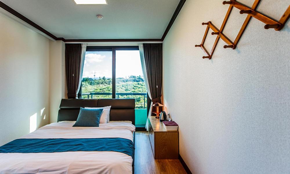 Postel nebo postele na pokoji v ubytování Cutie Pie Hotel