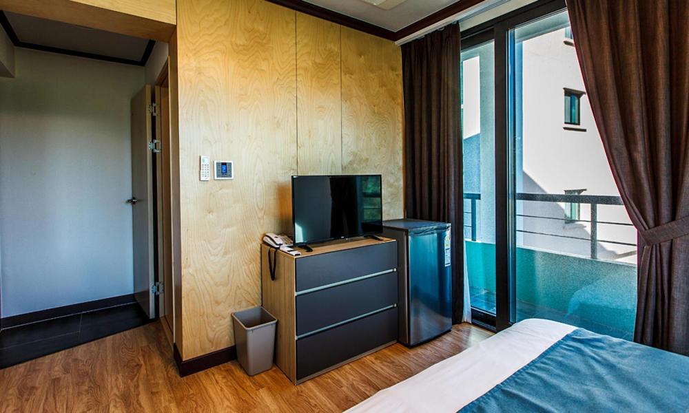 Postel nebo postele na pokoji v ubytování Cutie Pie Hotel