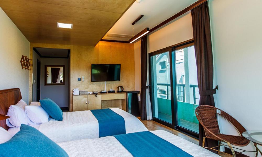 Postel nebo postele na pokoji v ubytování Cutie Pie Hotel