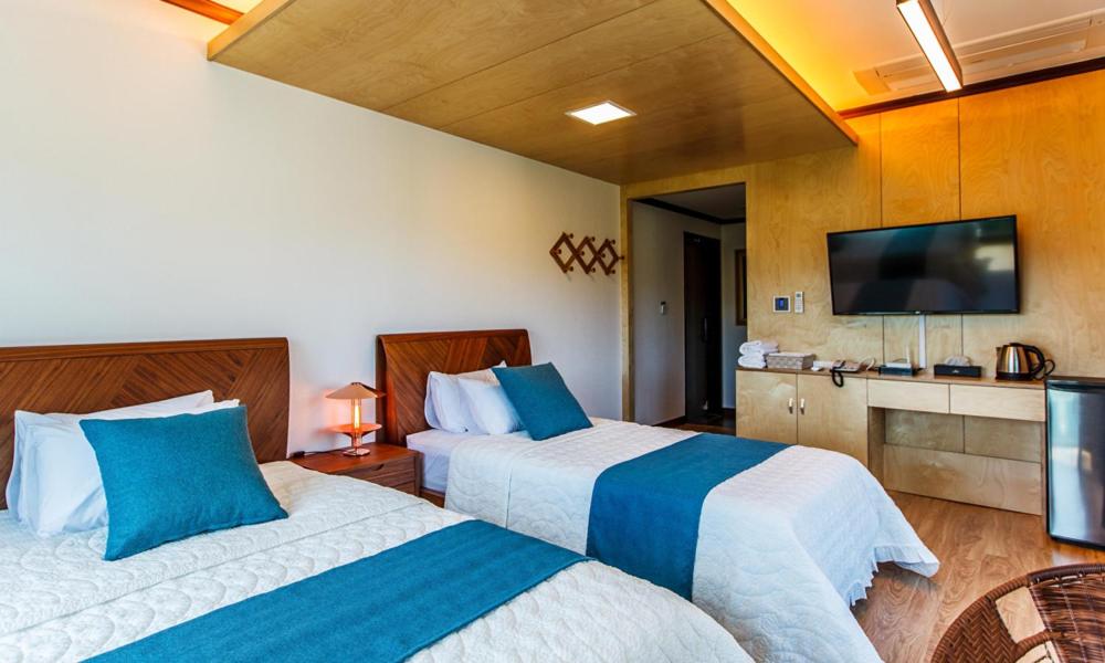 Postel nebo postele na pokoji v ubytování Cutie Pie Hotel