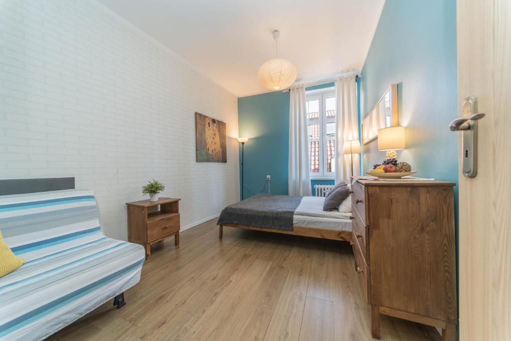 Posteľ alebo postele v izbe v ubytovaní Apartament Przytulny Starówka Old Town Piwna