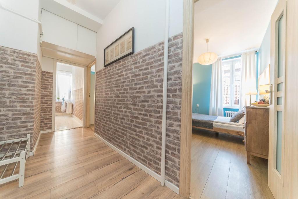 Posteľ alebo postele v izbe v ubytovaní Apartament Przytulny Starówka Old Town Piwna