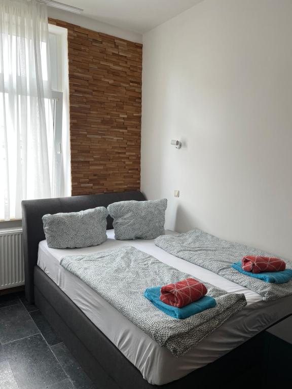 Postel nebo postele na pokoji v ubytování Gästehaus die Erfurter