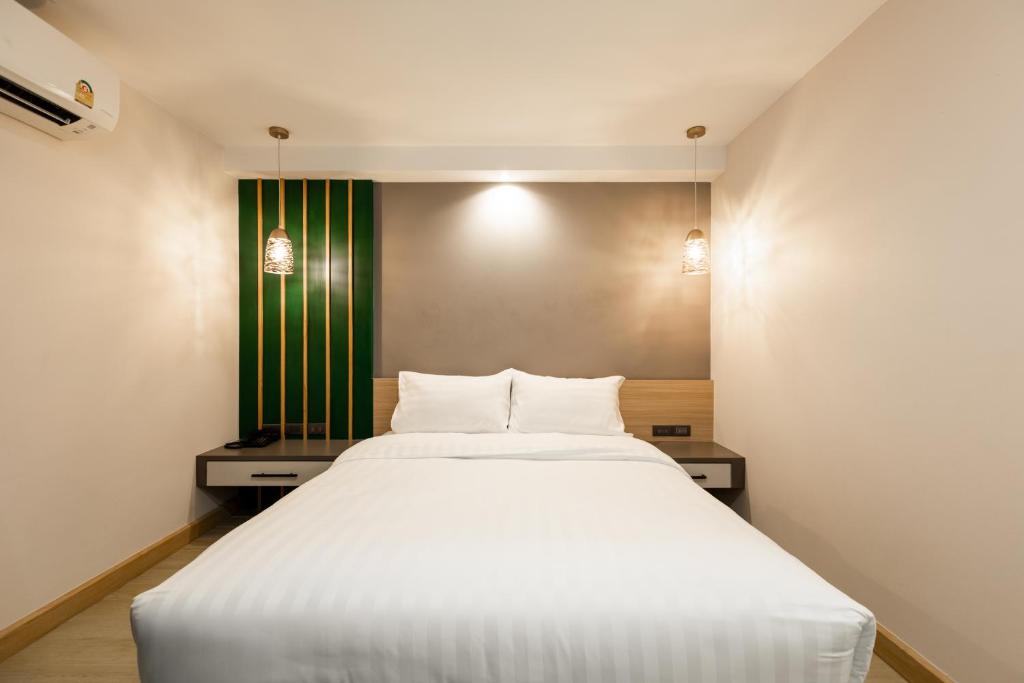 Postel nebo postele na pokoji v ubytování City Park Hotel Bangkok Pratunam by PCL