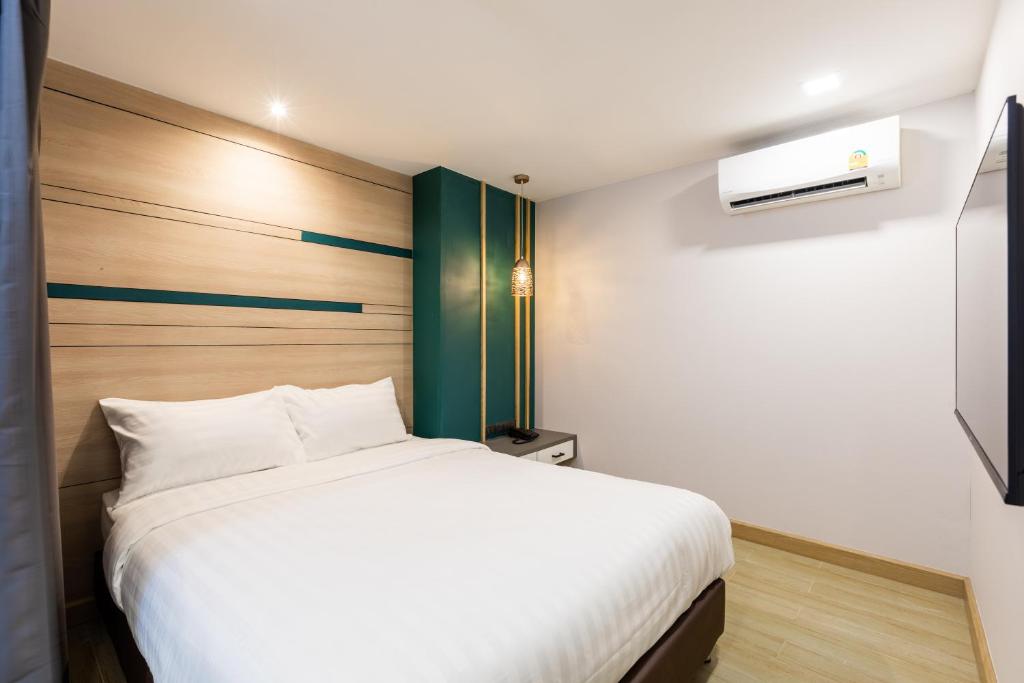 Postel nebo postele na pokoji v ubytování City Park Hotel Bangkok Pratunam by PCL