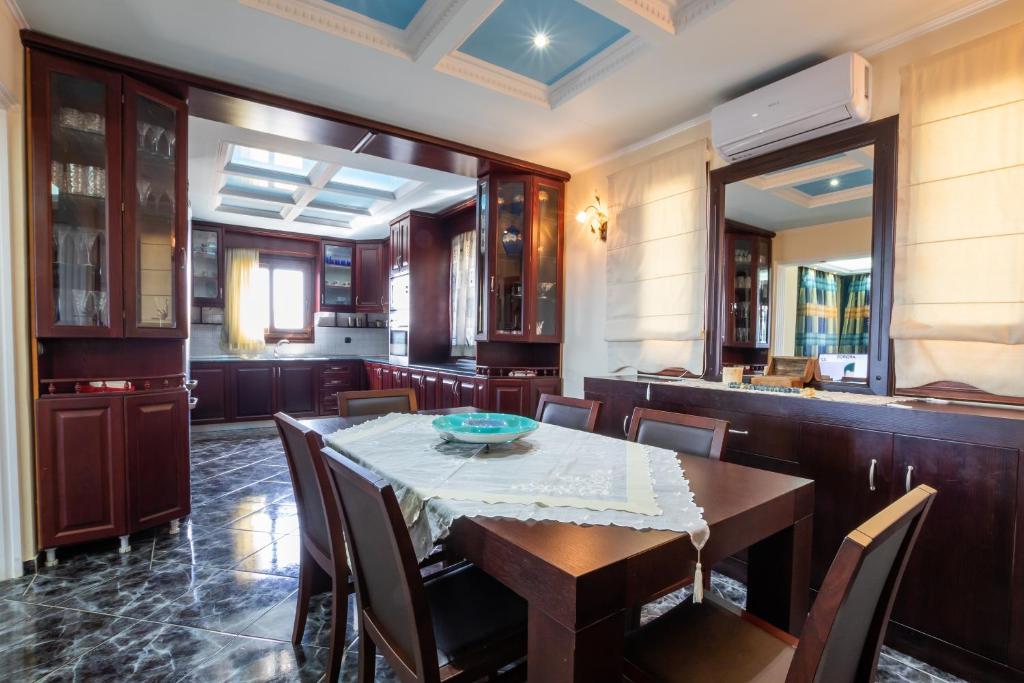 a dining room with a table and chairs at Oceanviewvilla in Karpathos