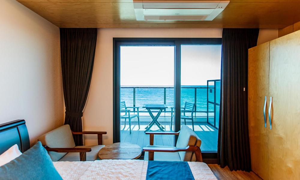 Postel nebo postele na pokoji v ubytování Cutie Pie Hotel