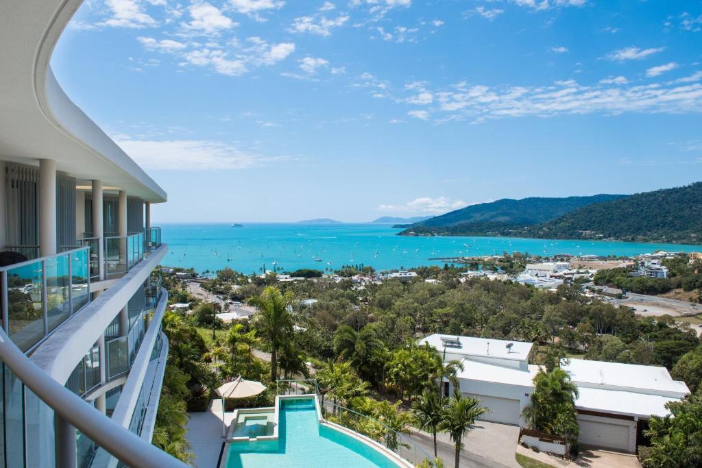 a view of the water from the balcony of a condo at Pacific Blue Whitsunday - Studio in Airlie Beach