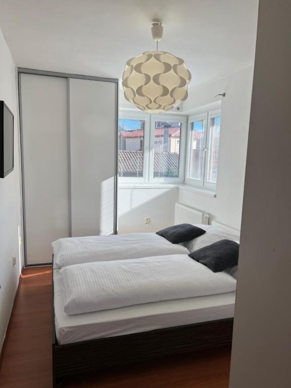 Postel nebo postele na pokoji v ubytování Vila Tatra