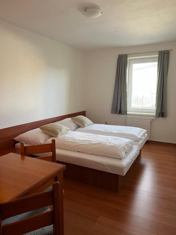 Postel nebo postele na pokoji v ubytování Vila Tatra