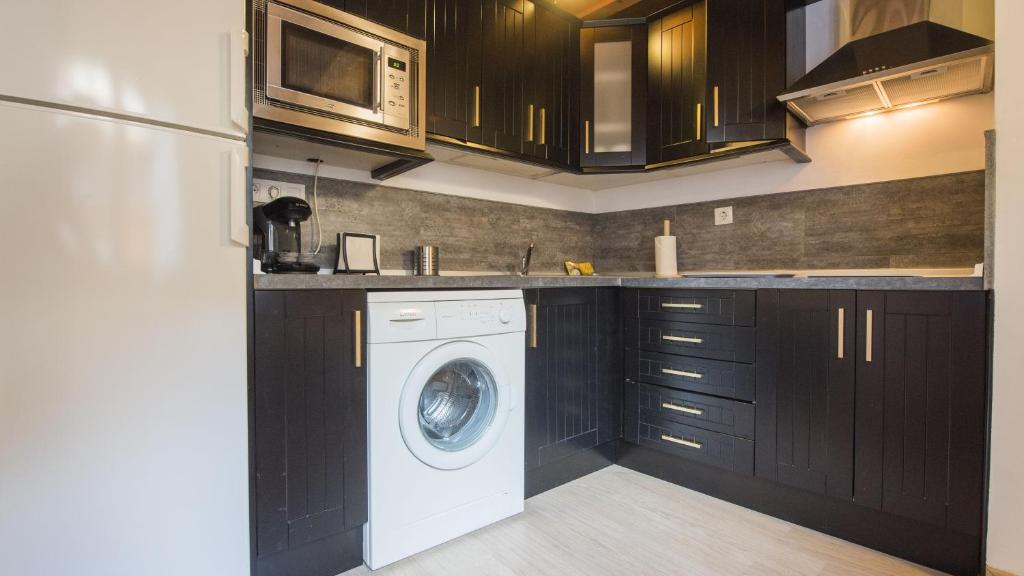 Kuchyň nebo kuchyňský kout v ubytování Madera y Piedra - Apartamentos Aloha Toledo