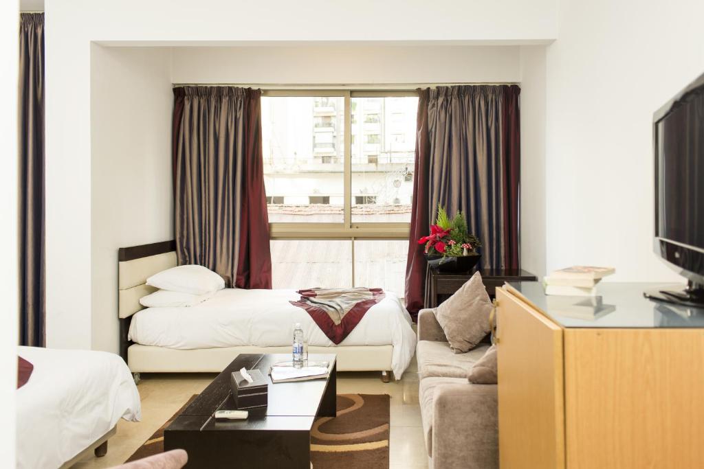 Postel nebo postele na pokoji v ubytování Bliss 3000 Furnished Studios