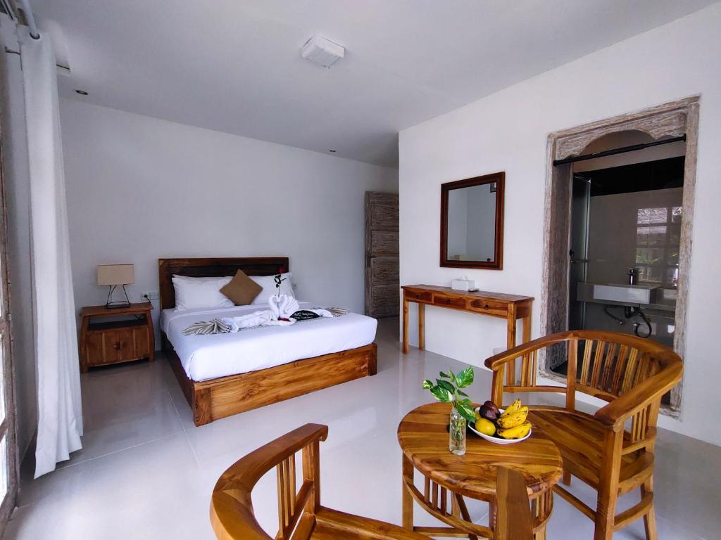 Postel nebo postele na pokoji v ubytování Aventus Resort Ubud