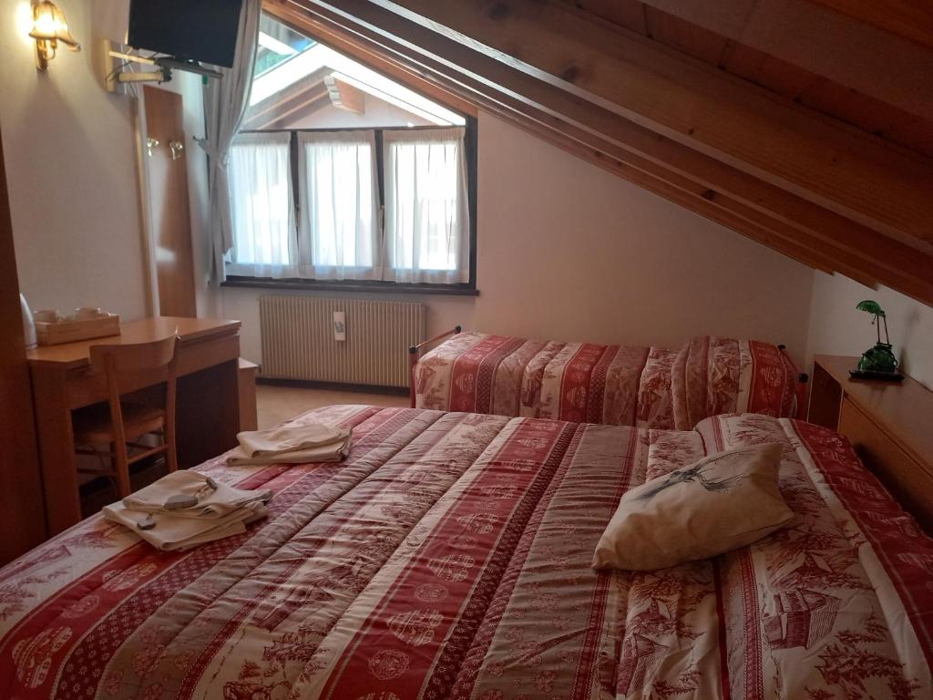 Postel nebo postele na pokoji v ubytování B&B Piazzi di Katia