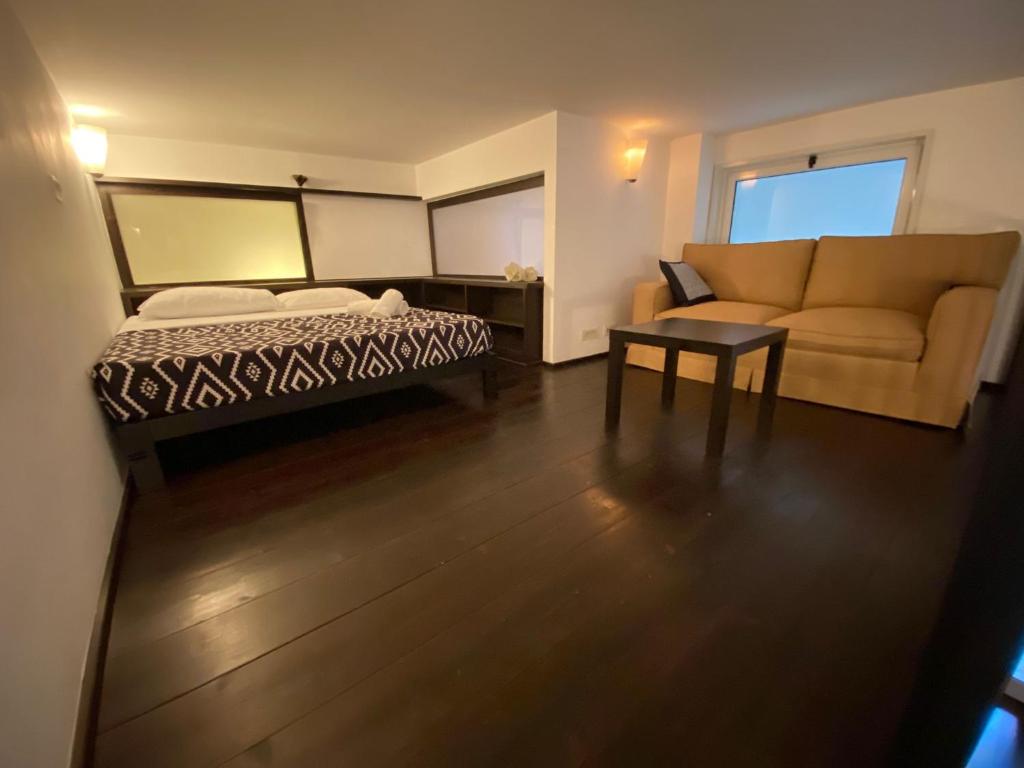 A bed or beds in a room at San Giovanni Lovely Loft