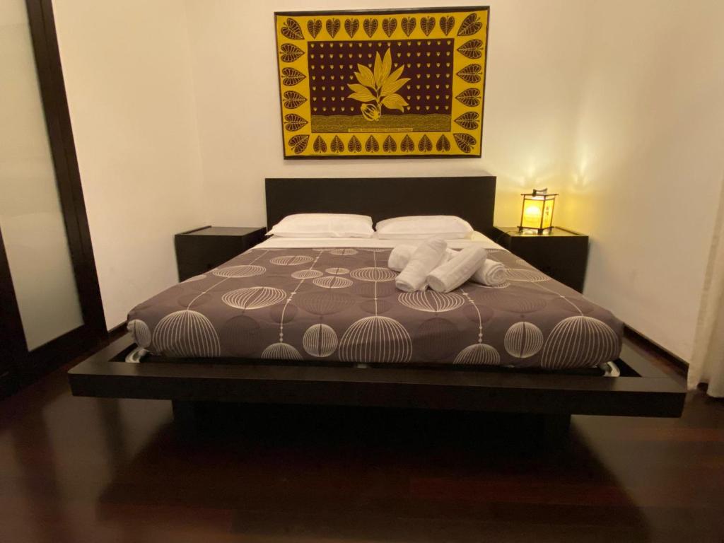 A bed or beds in a room at San Giovanni Lovely Loft