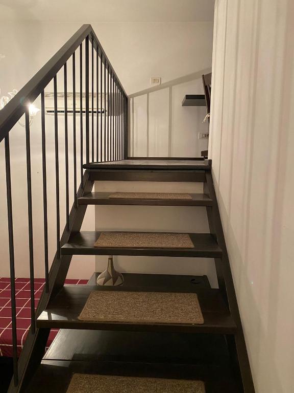 A bed or beds in a room at San Giovanni Lovely Loft
